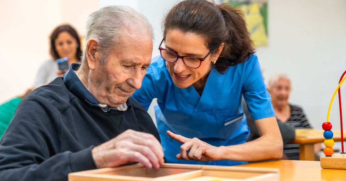 a senior man with his caregiver