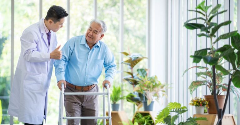 a senior men walking next to a doctor