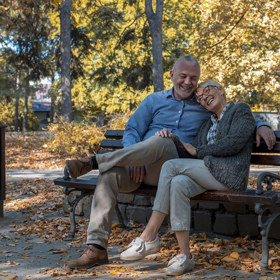 A Caucasian senior couple enjoying their time in the park
